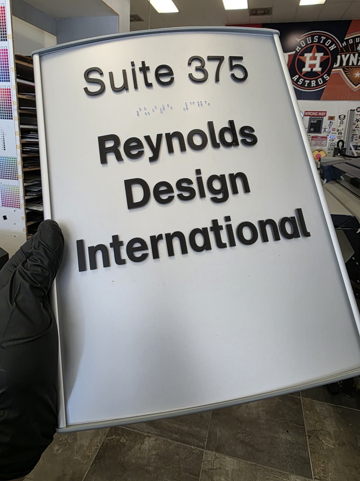 Dimensional suite sign with raised letters and Braille